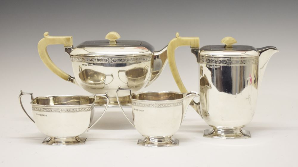George VI silver four piece tea set of tapering rectangular form comprising: hot water jug,