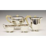 George VI silver four piece tea set of tapering rectangular form comprising: hot water jug,