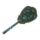 Chinese copper and enamel hand mirror, with shield-shaped bevelled plate, the reverse and