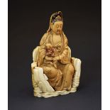 Unusual 19th Century carved soapstone figure of Kwanyin or Guan Yin, modelled in seating pose