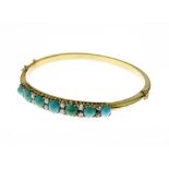Turquoise and diamond hinged bangle, in unmarked gold coloured metal, the seven graduated cabochon
