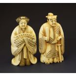 Pair of early 20th Century Japanese carved ivory okimono, one modelled in flowing robes and