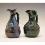 Two small Elton Ware jugs, both with foliate decoration, one being on a blue/brown ground, the other