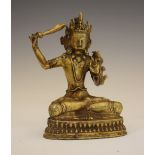 Sino-Tibetan bronze figure of Manjusri, seated in Dhyana Sana, the left hand in vitarka mudra, on