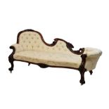 Victorian carved rosewood chaise longue, the deep-buttoned scooped back with cream foliate damask