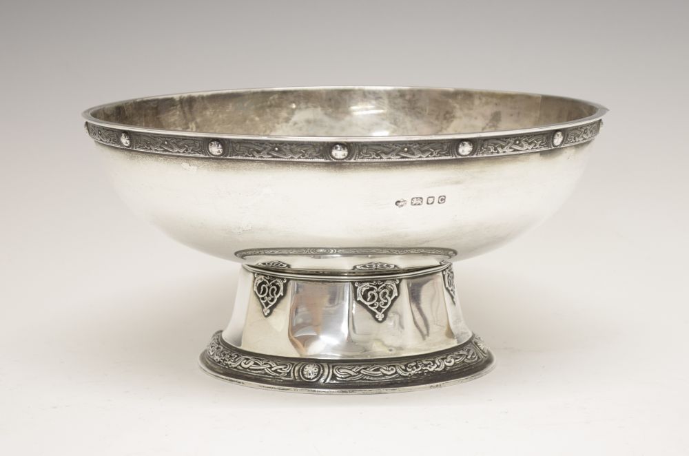 George VI silver footed bowl, with decorative rim border on a faceted spreading foot with scroll