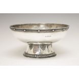 George VI silver footed bowl, with decorative rim border on a faceted spreading foot with scroll