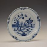 18th Century English Delftware plate, the circular field decorated with two Chinoiserie figures in a