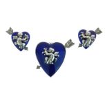 Heart dress clip, in blue enamel, pierced by an arrow and with an applied cherub, with ear clips