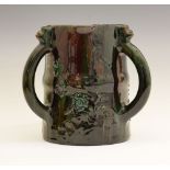 Elton Ware tyg, each loop handle with a mask head capital, decorated with flowers on a green/red