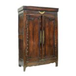 Late 18th/early 19th Century French cherrywood armoire, the plain detachable cornice over brass