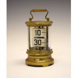 Early to mid 20th Century brass-cased Plato or ticket clock, having two registers of tickets