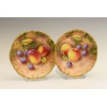 Pair of Royal Worcester porcelain pin dishes, signed Roberts, one painted with apples and