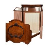 Victorian figured mahogany bed, the header with serpentine moulded cornice over vertical bars and
