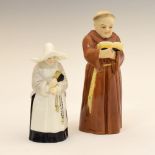 Two Royal Worcester porcelain candle snuffers, modelled as a monk and nun respectively, the larger