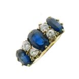 Sapphire and diamond ring, the three graduated oval cuts with pairs of old cut diamonds between,