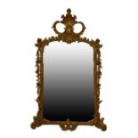 20th Century Chippendale Revival giltwood and gesso wall mirror, the plain plate within foliate