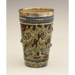George Tinworth for Doulton Lambeth - A silver-mounted stoneware lemonade beaker, the silver rim