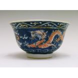 Chinese porcelain tea bowl, decorated in underglaze blue and Iron red with a pair of Imperial five-
