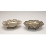 Pair of Middle Eastern white metal dishes, with engraved decoration, the rim having embossed and