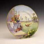 Royal Worcester porcelain plate, of wavy-edged form with gilt rim, the field decorated with a cock