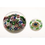 Spaced millefiori paperweight attributed to Clichy, having two 'Clichy' roses to the clear ground,