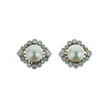 Pair of cultured pearl and diamond earstuds, the 7.8mm diameter pearl enclosed by an eye shaped