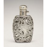 Continental white metal scent bottle, the flask-form body with foliate scroll cage-work overlay,