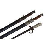 Two United Kingdom pattern 1907 bayonets, one by Wilkinson with crown over 1907, in its scabbard,