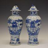 Pair of 19th Century Chinese porcelain vases and covers, each of Meiping form, the domed cover