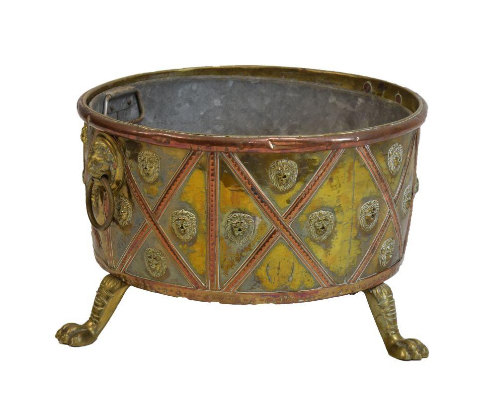 Unusual 19th Century brass and copper log bin or jardiniere, of circular form with lion mask