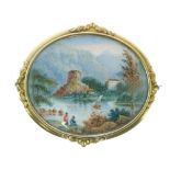 19th Century brooch, the oval frame with a painted lakeside landscape under glass, 7.4cm across