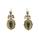 Pair of Victorian garnet and enamel drop earrings, with a scroll top fitting Condition: Unmarked