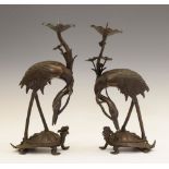 Pair of Japanese Meiji period bronze figural pricket candlesticks, modelled as cranes standing