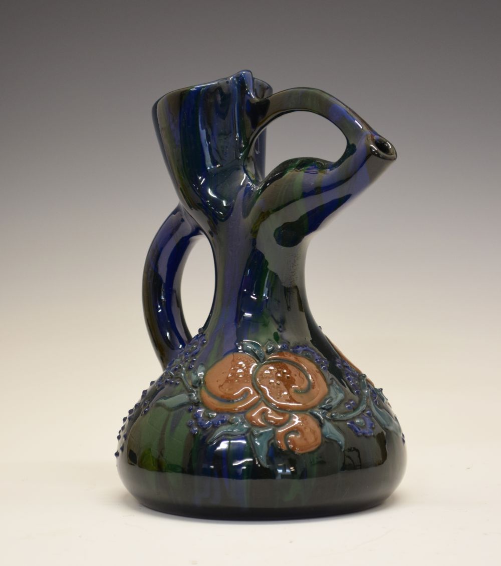 Elton Ware jug, with stylised spout, having foliate decoration on a green and blue ground, mark to