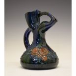Elton Ware jug, with stylised spout, having foliate decoration on a green and blue ground, mark to