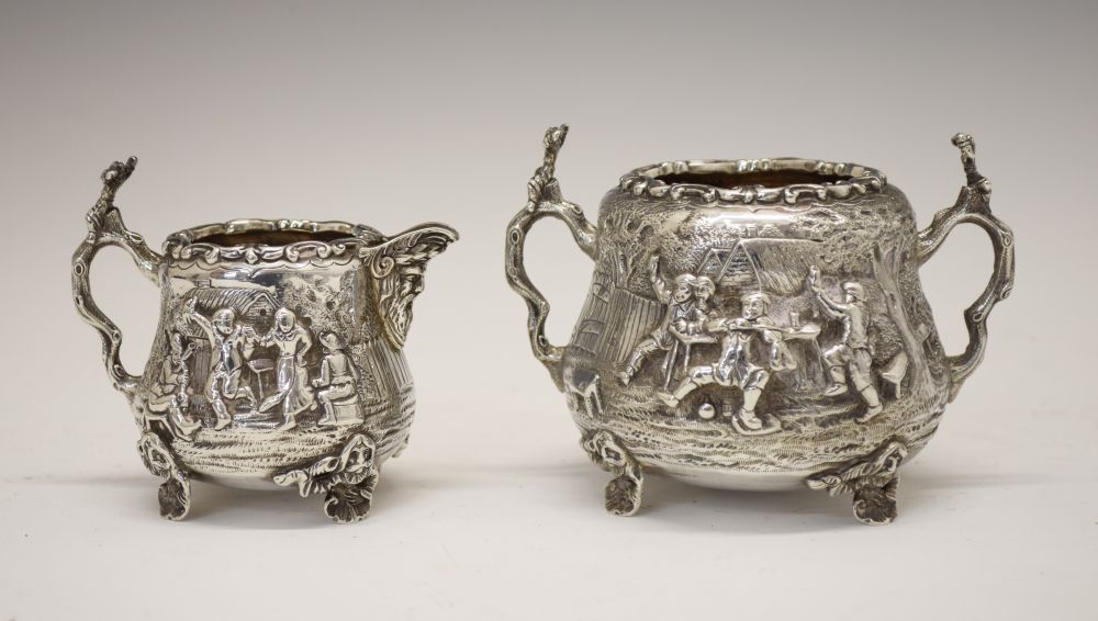 Edward VII silver milk jug and sugar basin, having allover decoration of a tavern exterior scene,