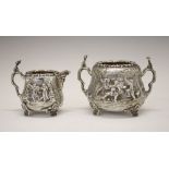 Edward VII silver milk jug and sugar basin, having allover decoration of a tavern exterior scene,