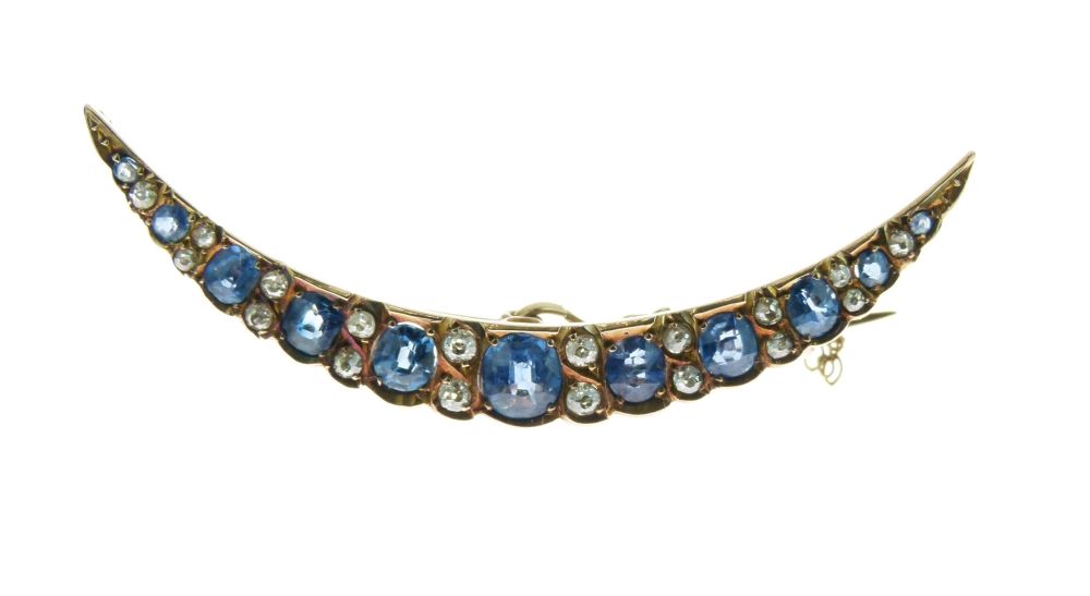 Sapphire and diamond crescent brooch, circa 1900, the graduated oval cuts with pairs of small old