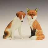 Royal Worcester porcelain models of a fox and hound, both seated, the hound 2994, 17cm high, the fox