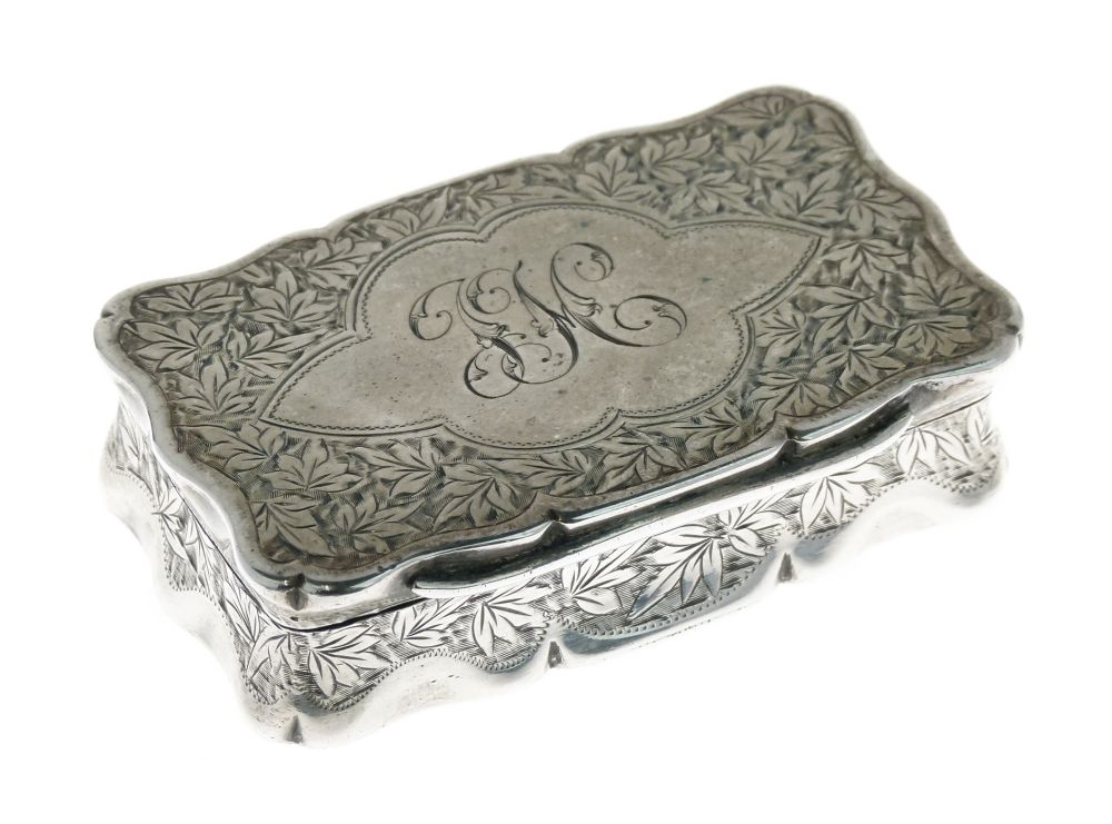 Late Victorian silver snuff box, of wavy outline with hinged cover centred by a cartouche, within