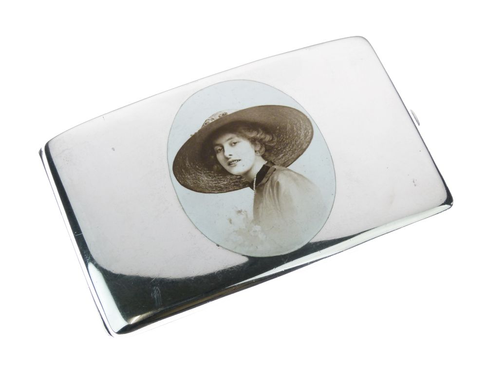 George V silver and enamel cigarette case, of large size, shaped for the hip, the hinged rectangular