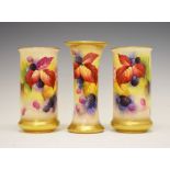 Three Royal Worcester porcelain vases decorated by Kitty Blake, comprising a pair of bulging