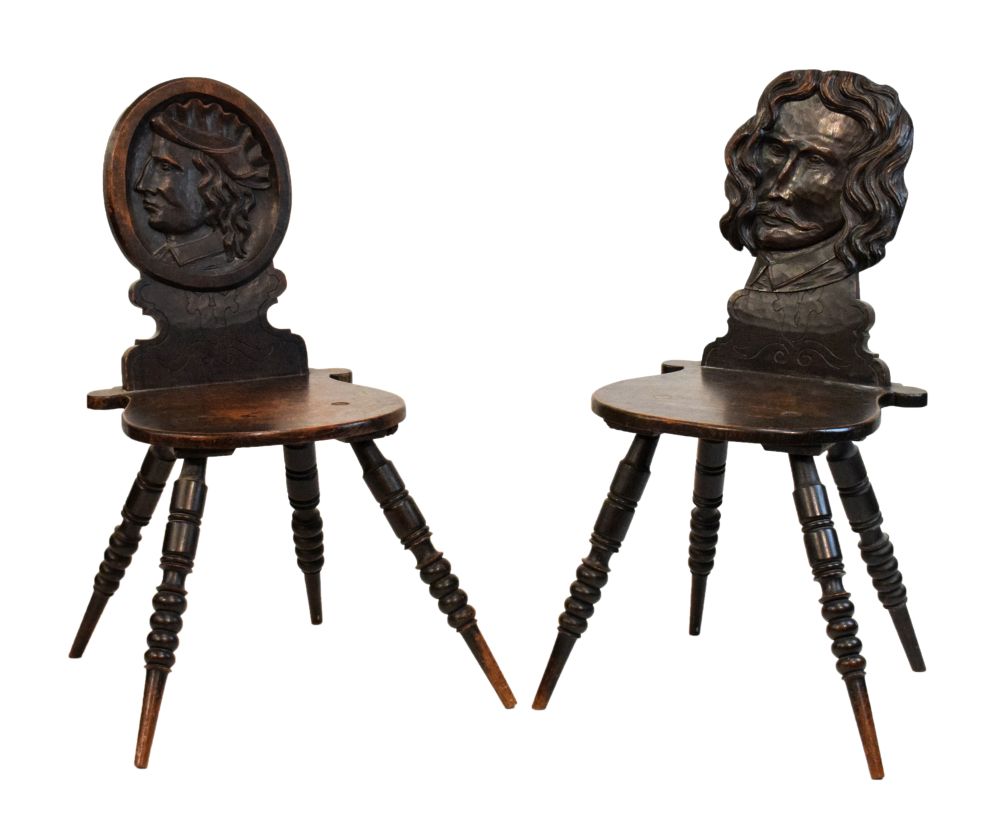 Two unusual 19th Century oak hall chairs, in the 'Romayne' tradition, one with oval back and