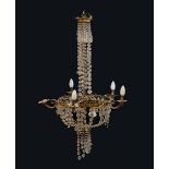 Early 20th Century brass and cut glass chandelier, with scroll-decorated brass frame,