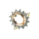 Topaz and diamond 18ct gold cluster ring, the oval cut stone measuring approximately 10mm x 7.9mm