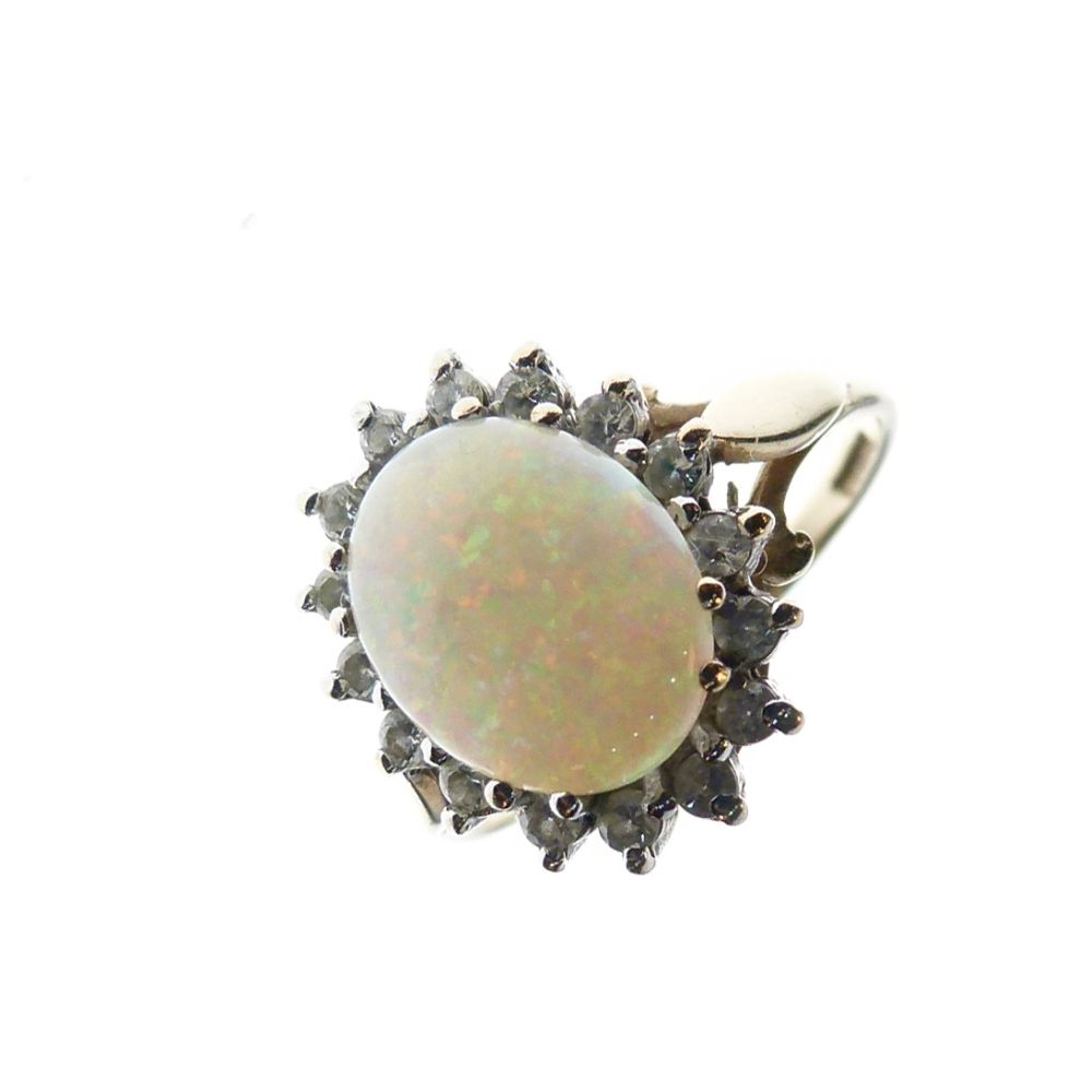 9ct gold, opal and diamond dress ring set oval opal approximately 10mm x 8mm, within sixteen small