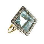 Good quality yellow metal, aquamarine and diamond-set dress ring, the large central aquamarine