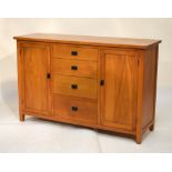 Modern sideboard fitted four drawers between cupboards, 140cm wide