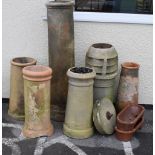 Group of six chimney pots, largest 122cm high, together with a pair of stoneware troughs and a small